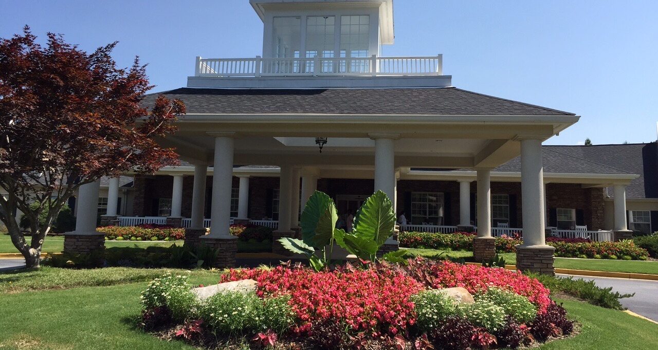 Azalea Estates of Fayetteville front entrance with seasonal blooms