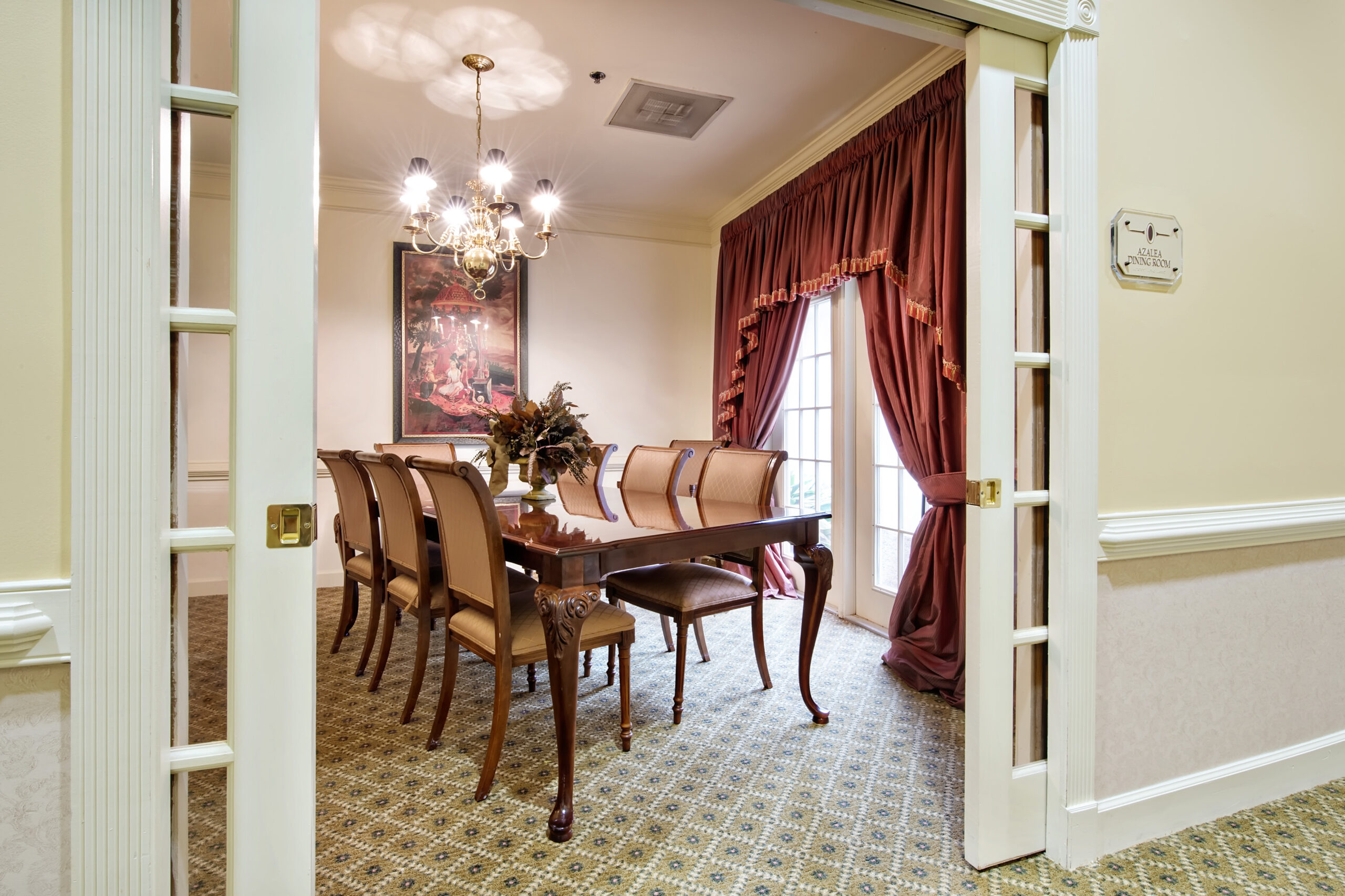 Elegant formal dining room set for service at Azalea Estates
