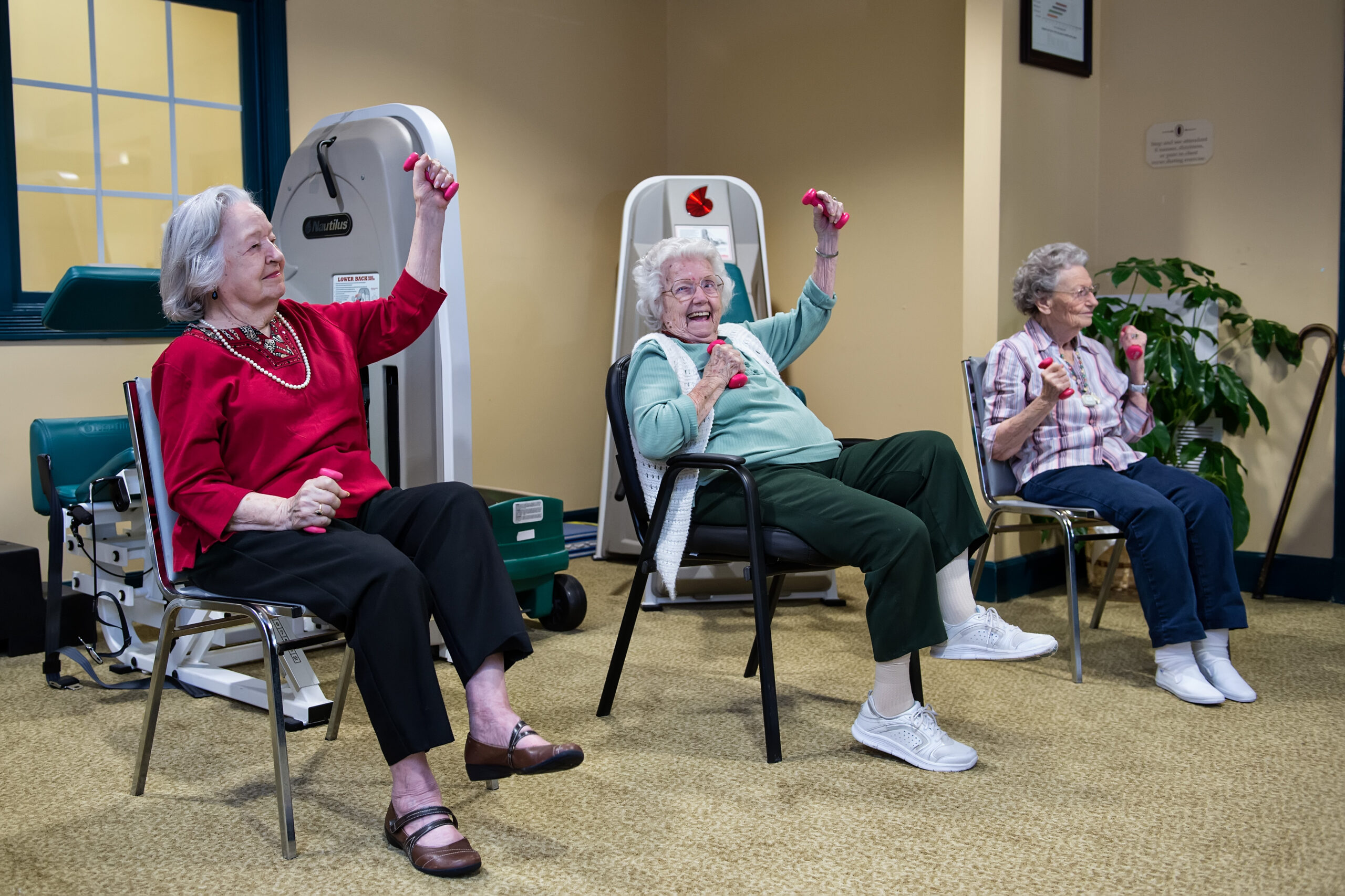 Residents in a group exercise class focused on mobility and strength